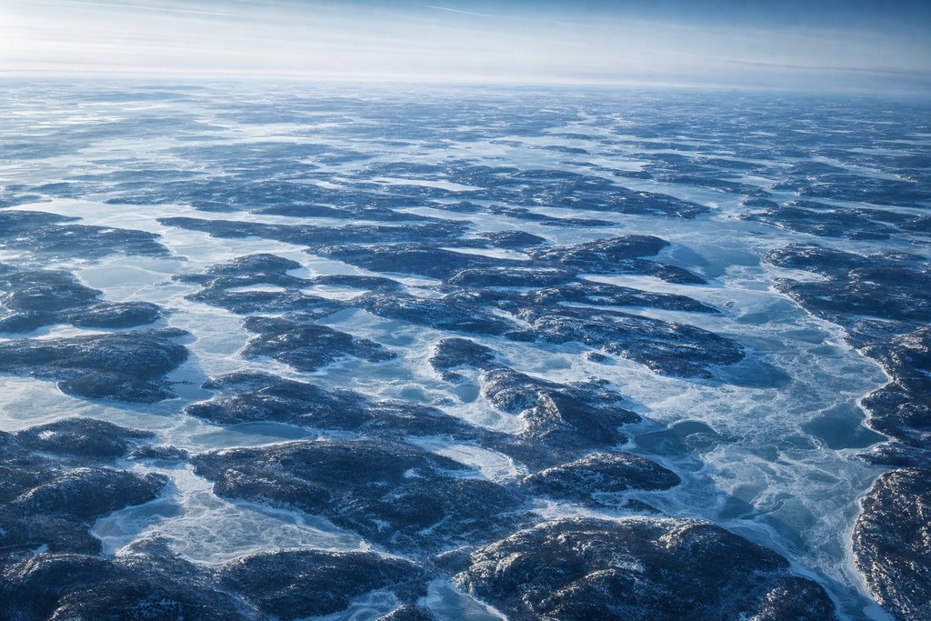 Aerial view of Canadian Shield country — hundreds of interlocking lakes between low granite ridges, partly frozen — the plate for the Ontario safety index